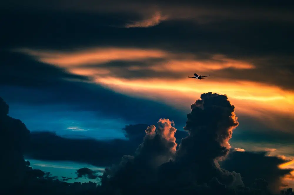 Free Amazing Sky Backgrounds for Designers: Plane in Sunset