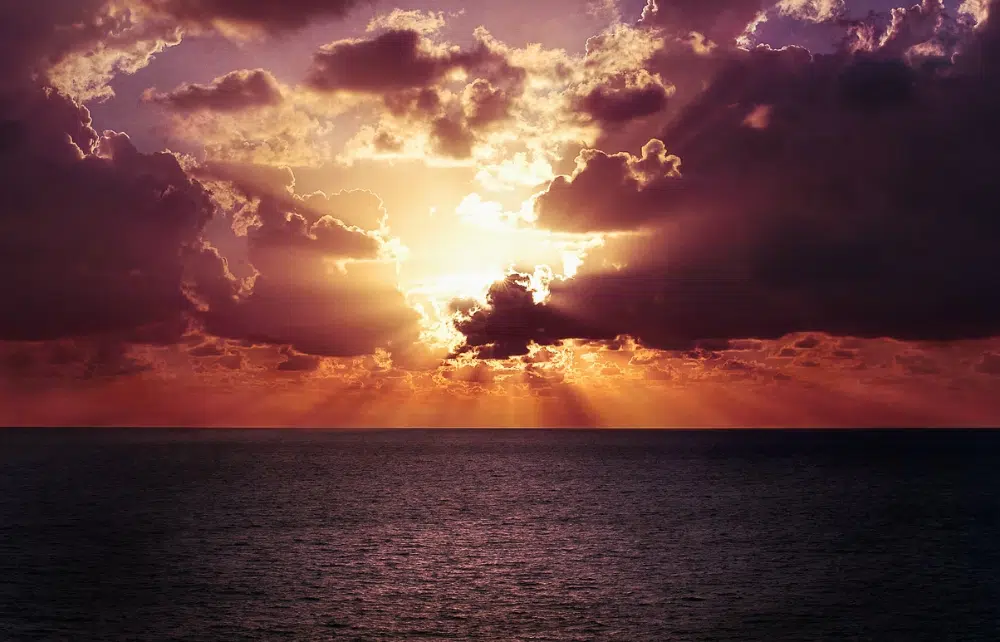 Free Amazing Sky Backgrounds for Designers: Evening Clouds over Sea.avif