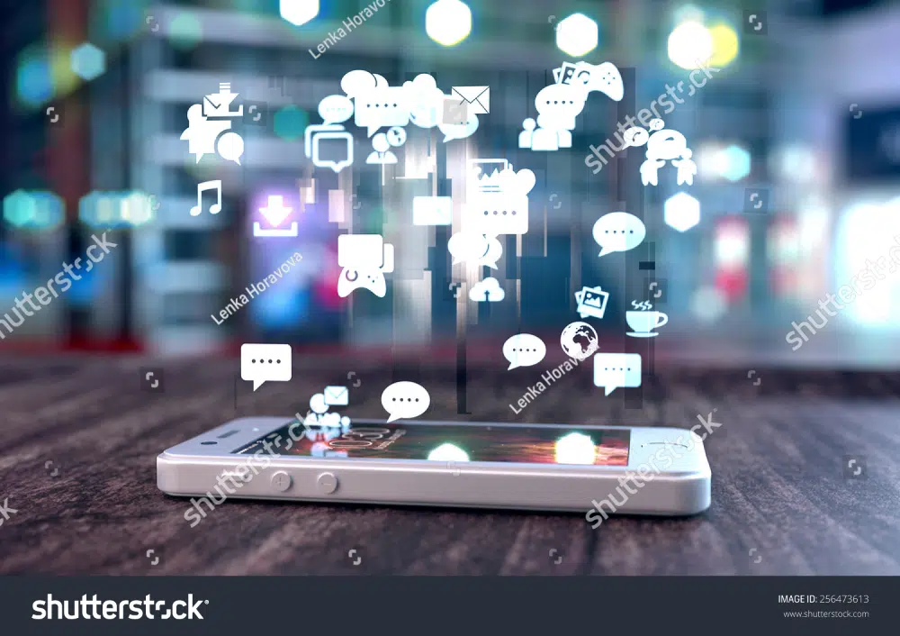 Shutterstock Smart Phone On Wooden Table Social Media Icons